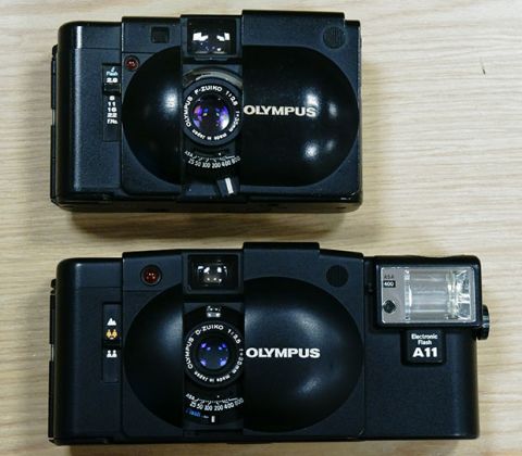 Olympus XA, typically costing $65-75 with dedicated flash.