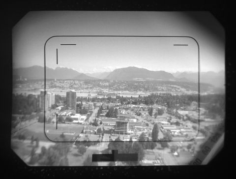 Werramat’s viewfinder: frame lines with parallax markings, litght meter indicator (bottom-center) and lens readings (bottom-right). Note that the lens readings are projected via mirrors — it’s not an enormous barrel; also, I wasn’t able to catch the aperture values with my iPhone here, which are normally visible if you look through (even with glasses on).