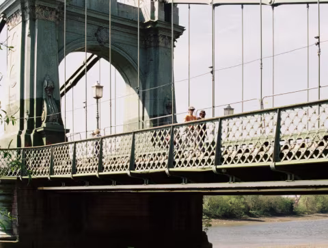 The lattice railings along the side walkways and their decorative star-shaped motifs.