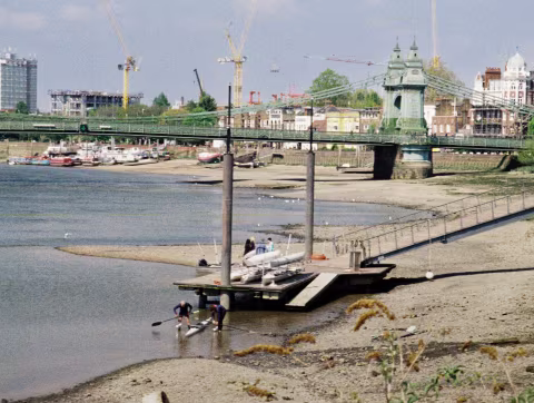  One of the several floating piers in this area of London, and the bridge in the background.
