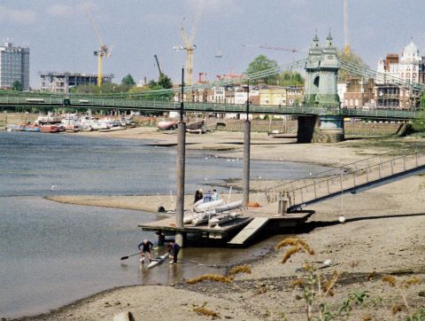  One of the several floating piers in this area of London, and the bridge in the background.