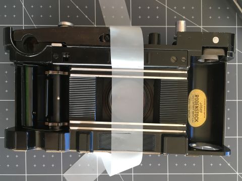 Figure 1: CORRECT: carefully stretch your frosted tape so that it sticks to the rails meant to keep the film flat against the camera’s pressure plate.