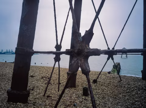 Pylons supporting the inner lighthouse.  In the background, the outer lighthouse.