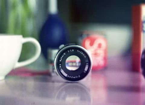 A portrait of an Olympus f/1.8 F.Zuiko Auto-S Lens.