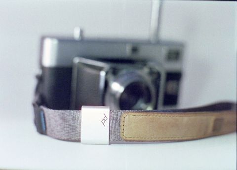 Peak Design’s “Cuff” wrist strap with its silver slider in focus.