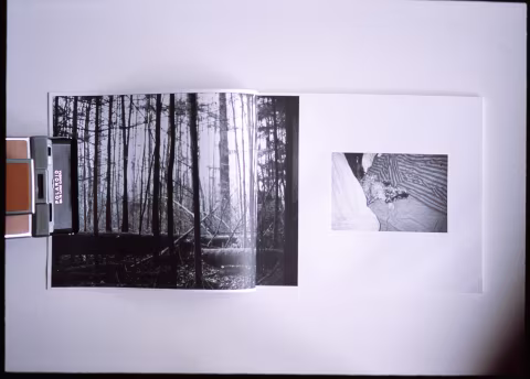 Moscow Dayze book page spread with Polaroid SX-70 camera for scale.