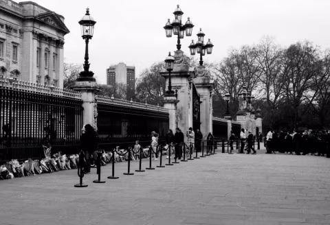 Flowers laid at the gates: Buckingham Palace, London, 9-10 April 2021. Taken with the Canon EF and an NFD 50 mm f./1.4 on Eastman Double-X film.