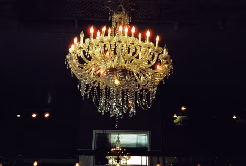 Flickering Halo Glow on Chandelier Lights in Carlsbad, California. Taken with a Yashica T5 and CineStill 800T film.