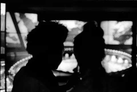 Silhouettes before Dr. Strangelove (1964)
Visitors pause in front of a screening of a clip from “Dr. Strangelove or: How I Learned to Stop Worrying and Love the Bomb” (1964), starring Peter Sellers, George C. Scott, and Sterling Hayden. 