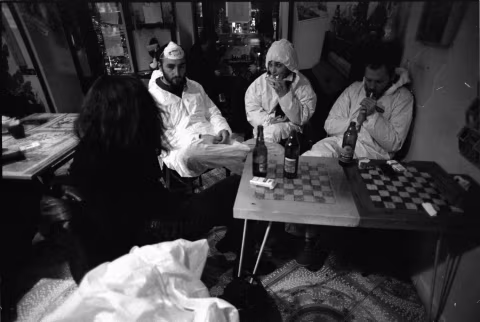 Party costumes from a past gathering. Hazmat suits, masks, and cigarettes.