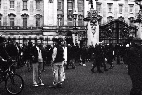 People at the gates, Buckingham Palace, London, 9-10 April 2021. Taken with the Canon EF camera and a Tamron 70-150 mm f./3.8 lens on Eastman Double-X film.