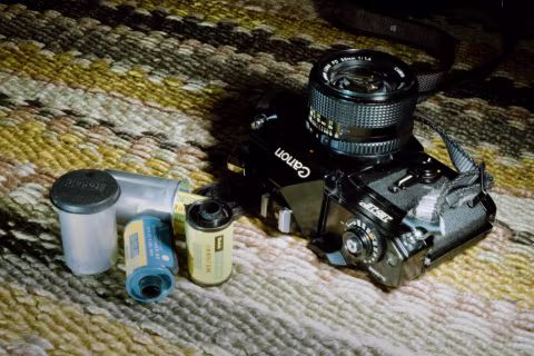 The Canon EF and some refillable 35 mm film cartridges from the days before DX codes. Taken with an Olympus IS-3000 bridge camera on Kodak Color Plus 200 film.