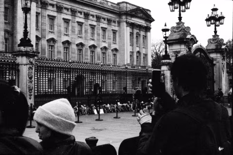 People a the gates, Buckingham Palace, London, 9-10 April 2021. Taken with the Canon EF camera with a Tamron 17 mm f./3.5 lens on Eastman Double-X film.