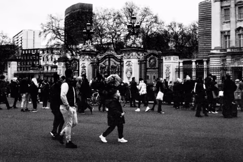People at the gates, Buckingham Palace, London, 9-10 April 2021. Taken with the Canon EF camera and a Tamron 70-150 mm f./3.8 lens on Eastman Double-X film.