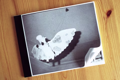 Moscow Dayze photobook cover design is aware of the spine — notice how the photograph forms a uniform white border.