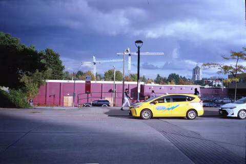 This photograph was taken with zone-focused Chinon Bellami. I used the hyperfocal focusing technique to keep everything, from the road tiles nearby to the condo on the horizon, in focus.