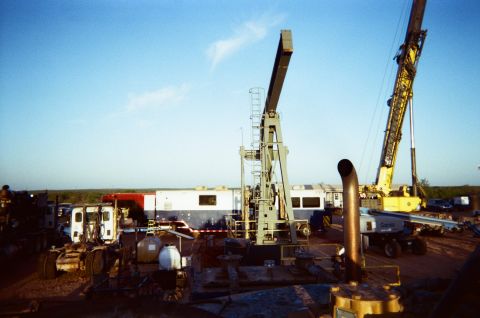 Production well in middle of Frac spread. DataVan in background.