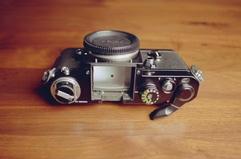 Nikon F2 with the power to the prism finder turned “ON” (notice the red dot that’s revealled when the film advance lever is pulled slightly).