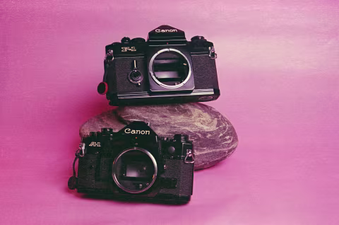 The fully-mechanical Canon F-1 (top) next to the electronically-controlled Canon A-1 (bottom).