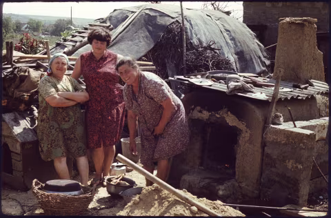My grandma on dad’s side (right) and the neighbours are about to cook up a storm as they welcome my mom’s side of the family from Moscow sometime before the wedding. Delen’ (Делень), Odessa, Ukraine, 1983.