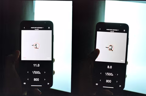 Figure 1. Scanning the light falloff on a sheet of paper with a light meter and marking each decreased stop of metered exposure.