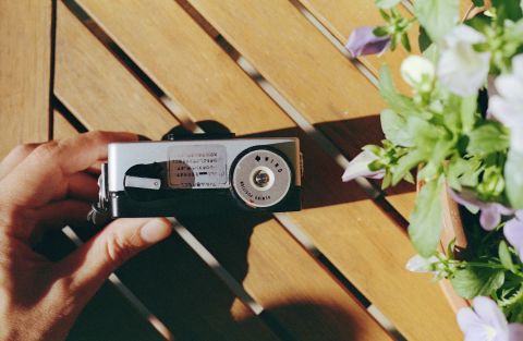 Ricoh Auto Half E2 bottom of the camera. On the left is a film rewind crank (with a tiny frame counter window next to it). On the right film advance spring winder set to the rewind position.