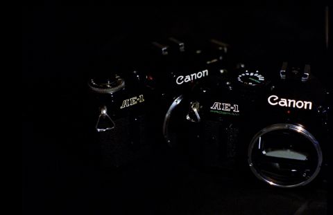 Canon AE-1 Program body next to Canon AE-1.