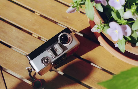 Ricoh Auto Half E2 top panel with a flash hot shoe, film speed selector, and aperture selector.