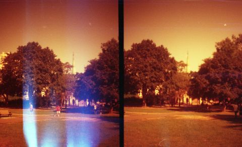 Flipped (redscale) Lomography Color Negative 400 on Diana Mini (in square mode) with light leaks.