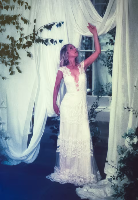Posing very gracefully amidst the draped fabrics.