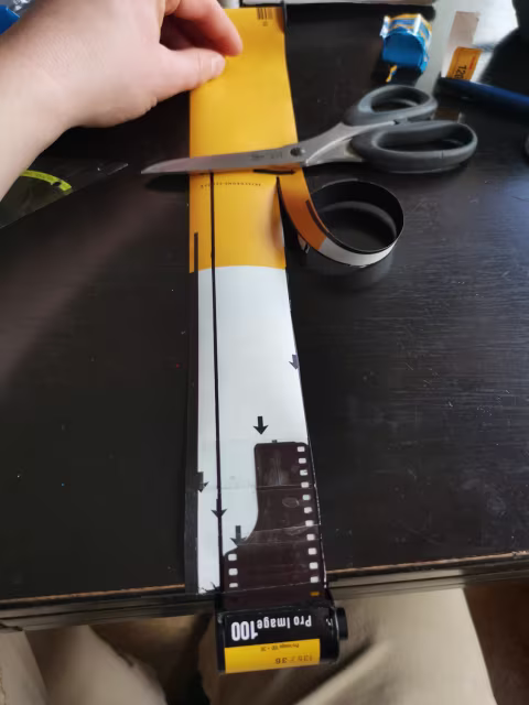 As you can see, using the start of a 120 mm film, cutting it into the right size to fit into a 35 mm film and spooling it back inside does the trick. Got the detailed explanation of how to do it from Peter Jeffrey, link at the end of the article.