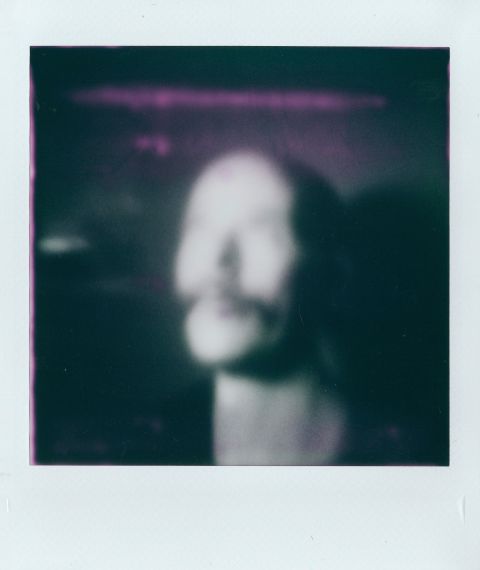 A portrait of me looking like Skeletor on Instax Square Monochrome with Gingerbread 2.