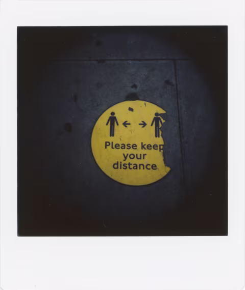 Photograph 4: near a bus stop in North London. As the rule of social distancing has ended, the signage on the pavement no longer needs to be replaced and it is left to fade away and peel off.