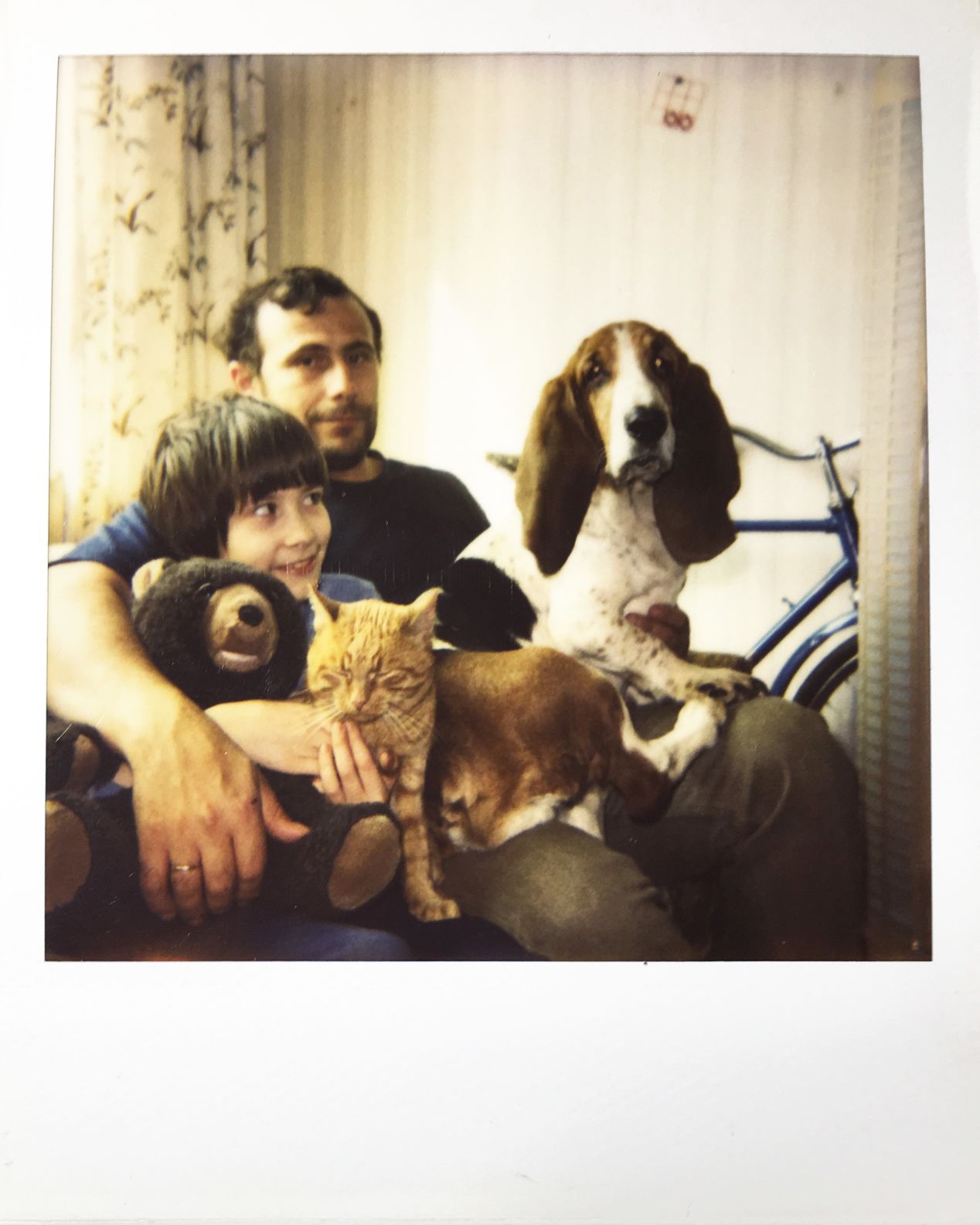 My plush bear, Medvediha, myself, our cat Fedossey, Dad, and our dog Frosia. Early ‘90s, Moscow. I’m pretty sure that behind us is my first real bicycle.