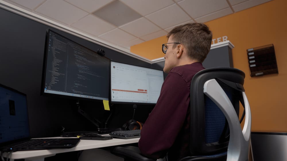 anchor group developers at desk writing netsuite code