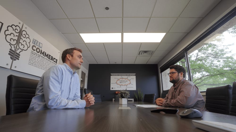 anchor group employee sitting with an ecommerce client