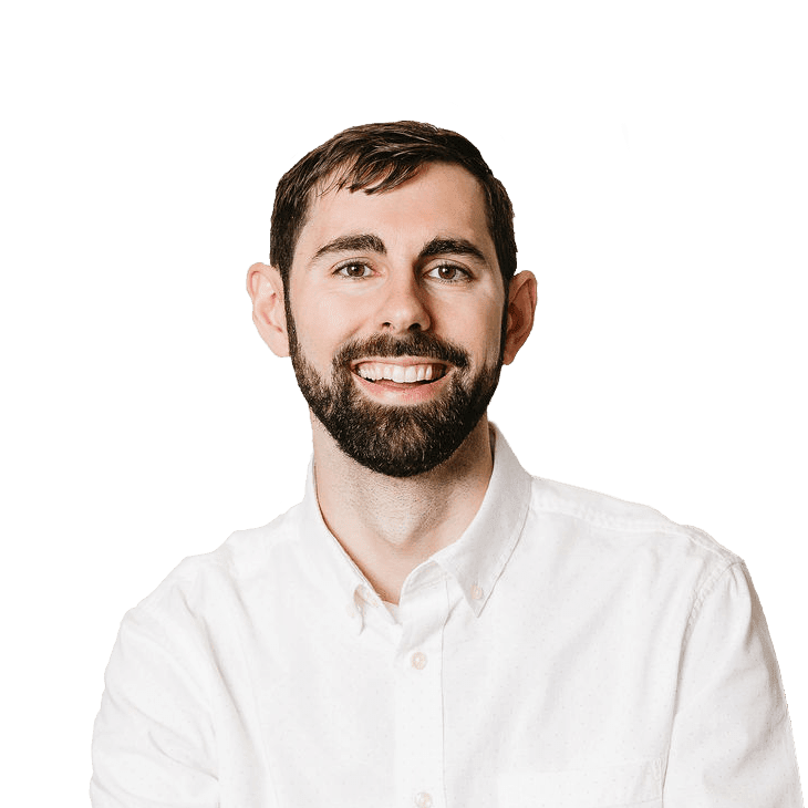 Jacob Terneus headshot, bearded man with brown hair wearing a white button down shirt smiling.