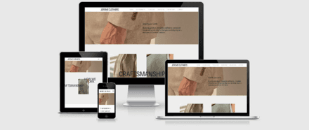 Website design showcasing a modern clothing store layout with product images and navigation elements.