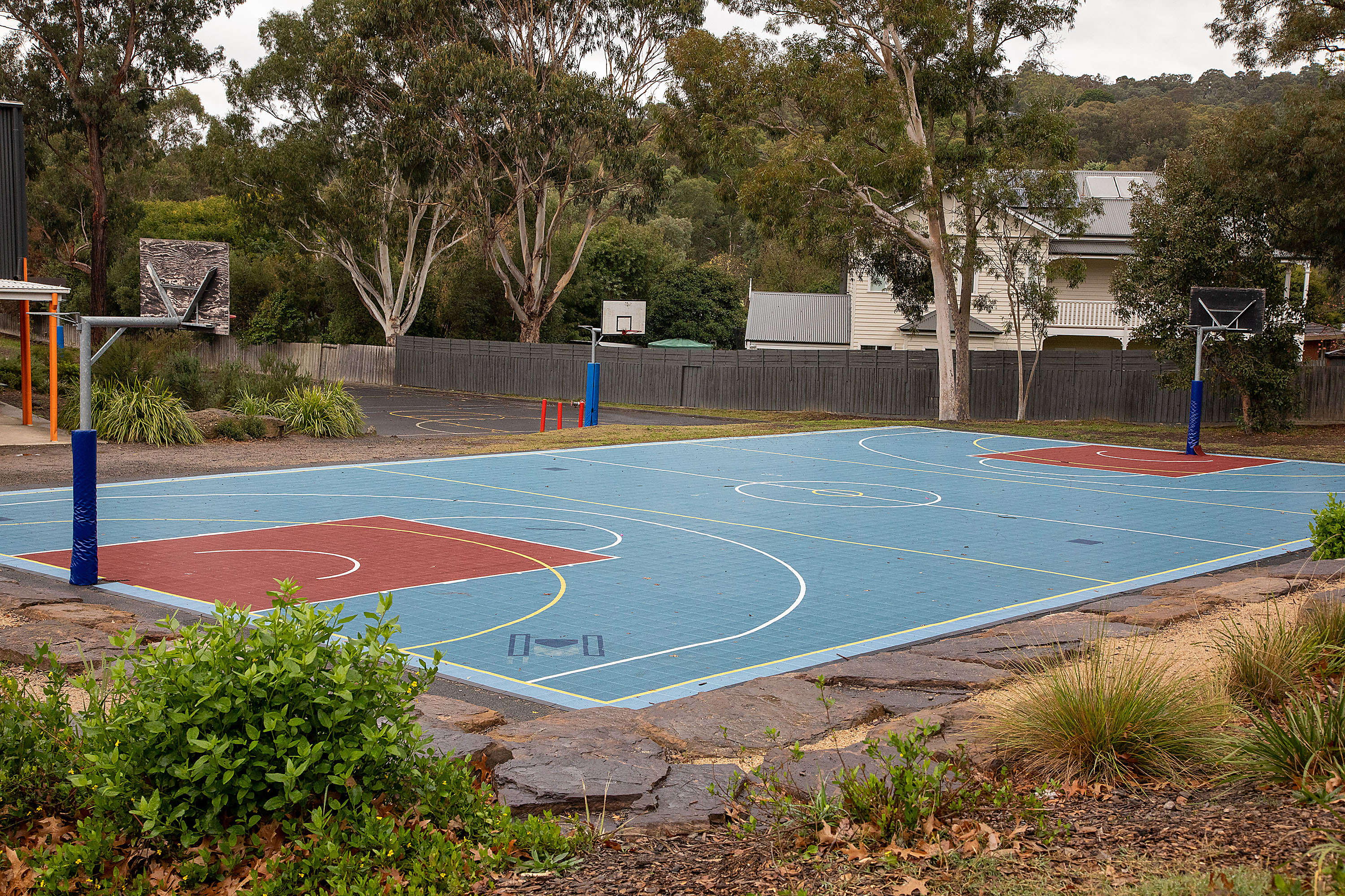 Basketball court with netball court in the background