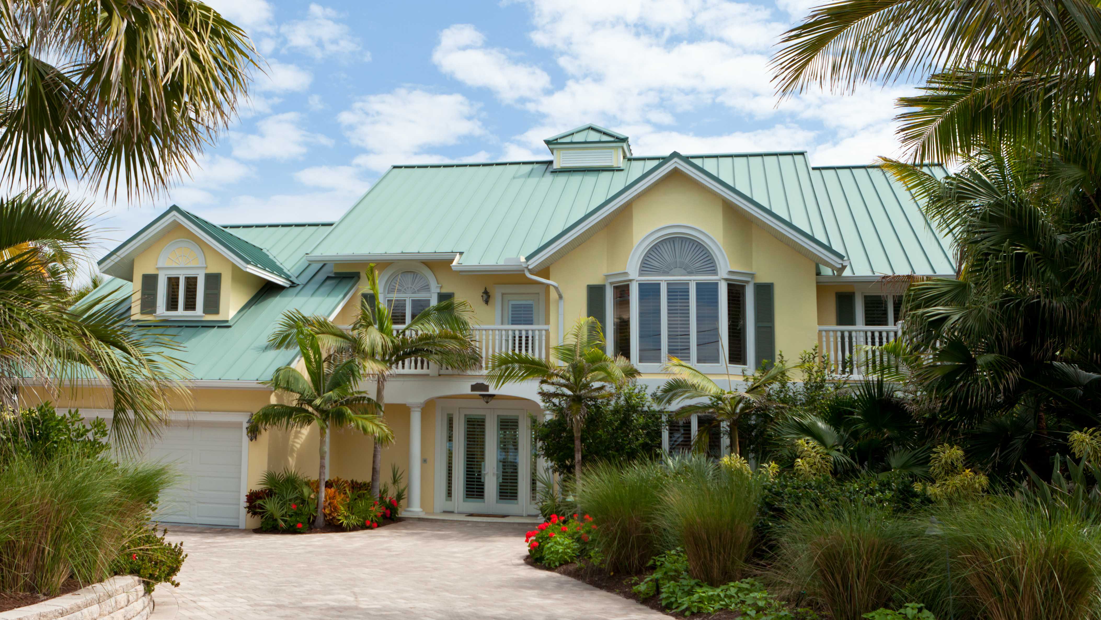 Yellow house with green metal roof in Florida