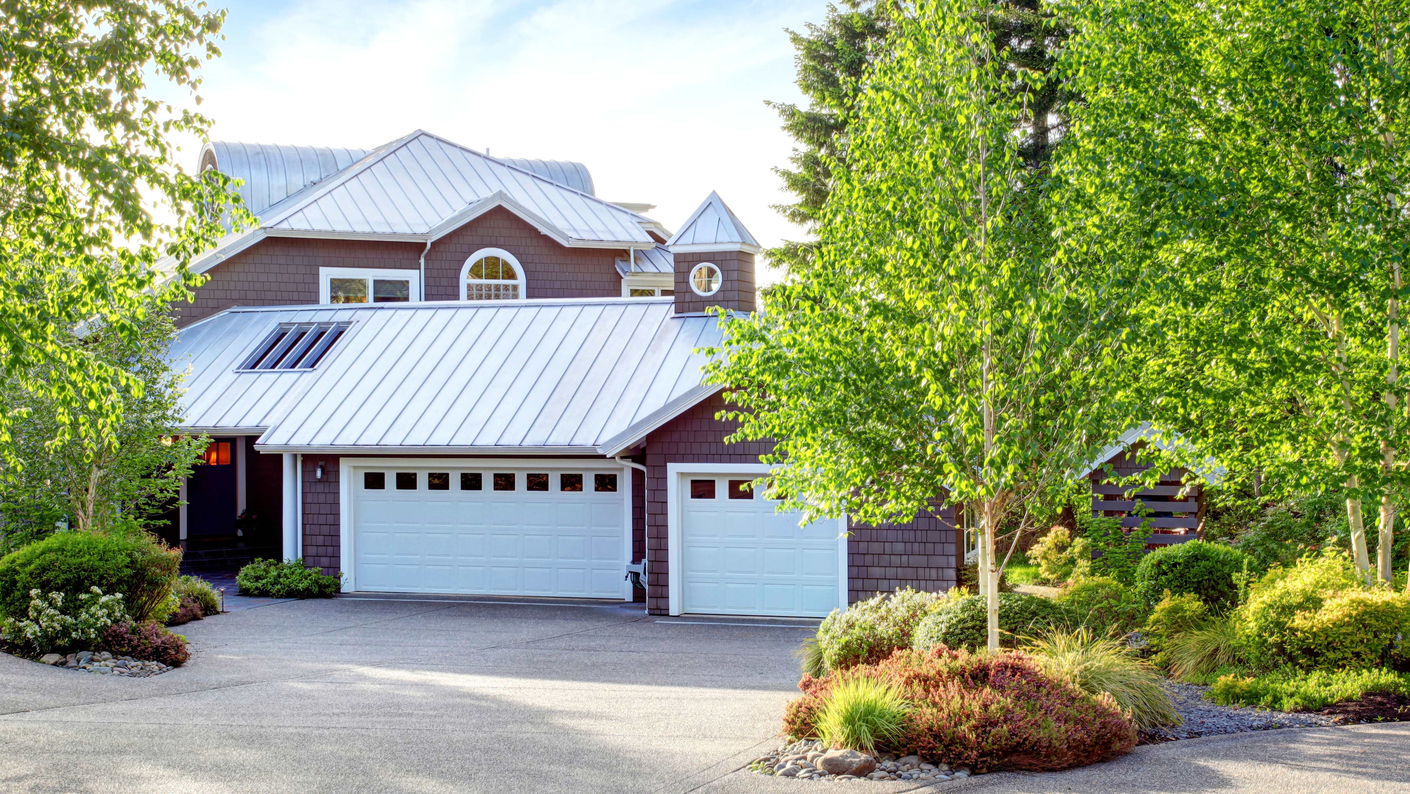 Standing seam metal roof installed in a house surrounded by trees