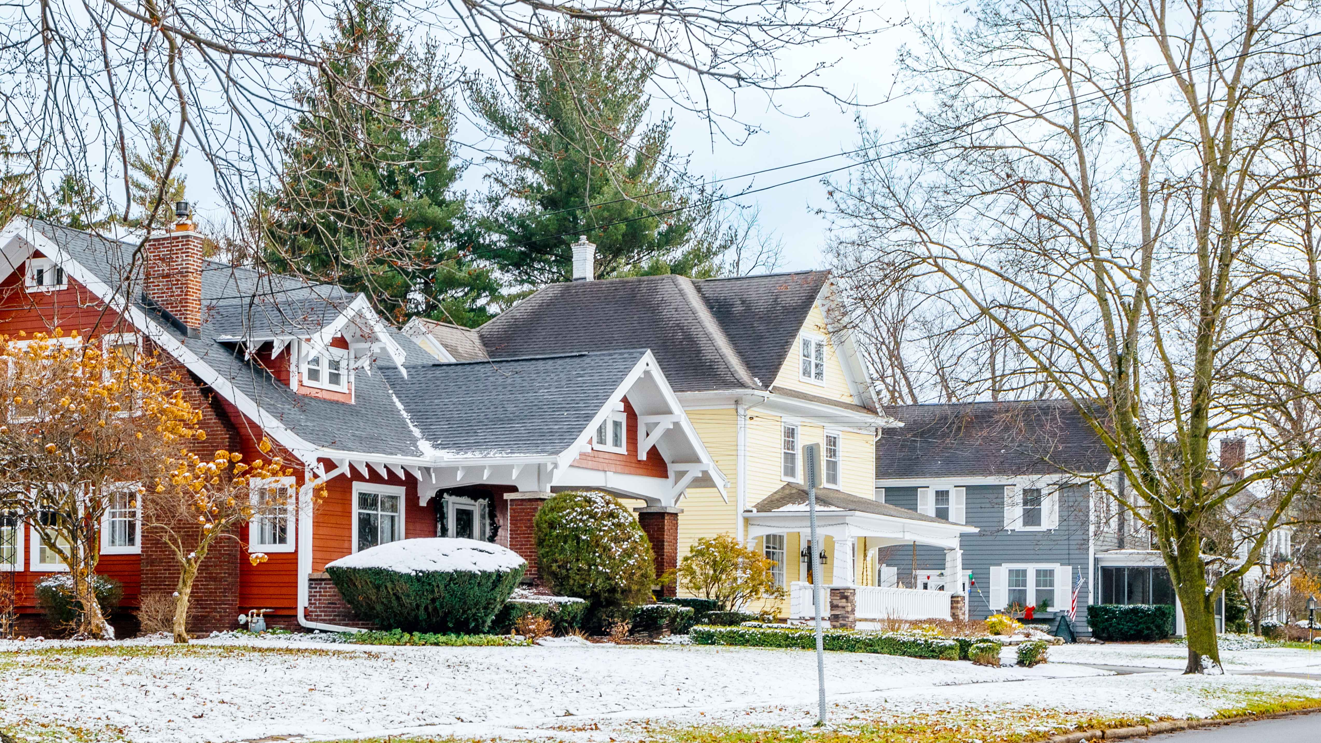 A row of houses in New York after a light dusting of snow