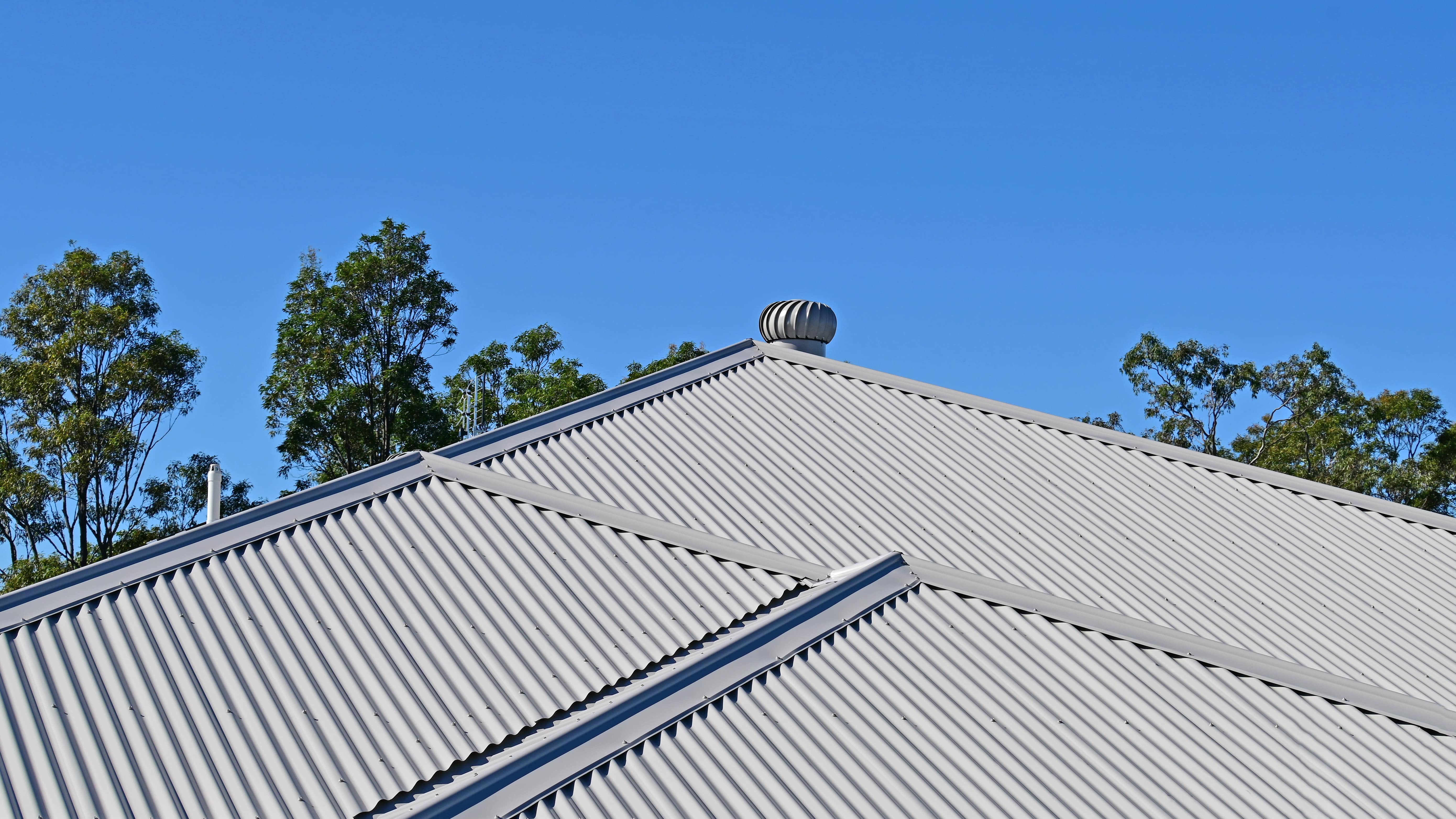 Gray corrugated metal roof installed on a house