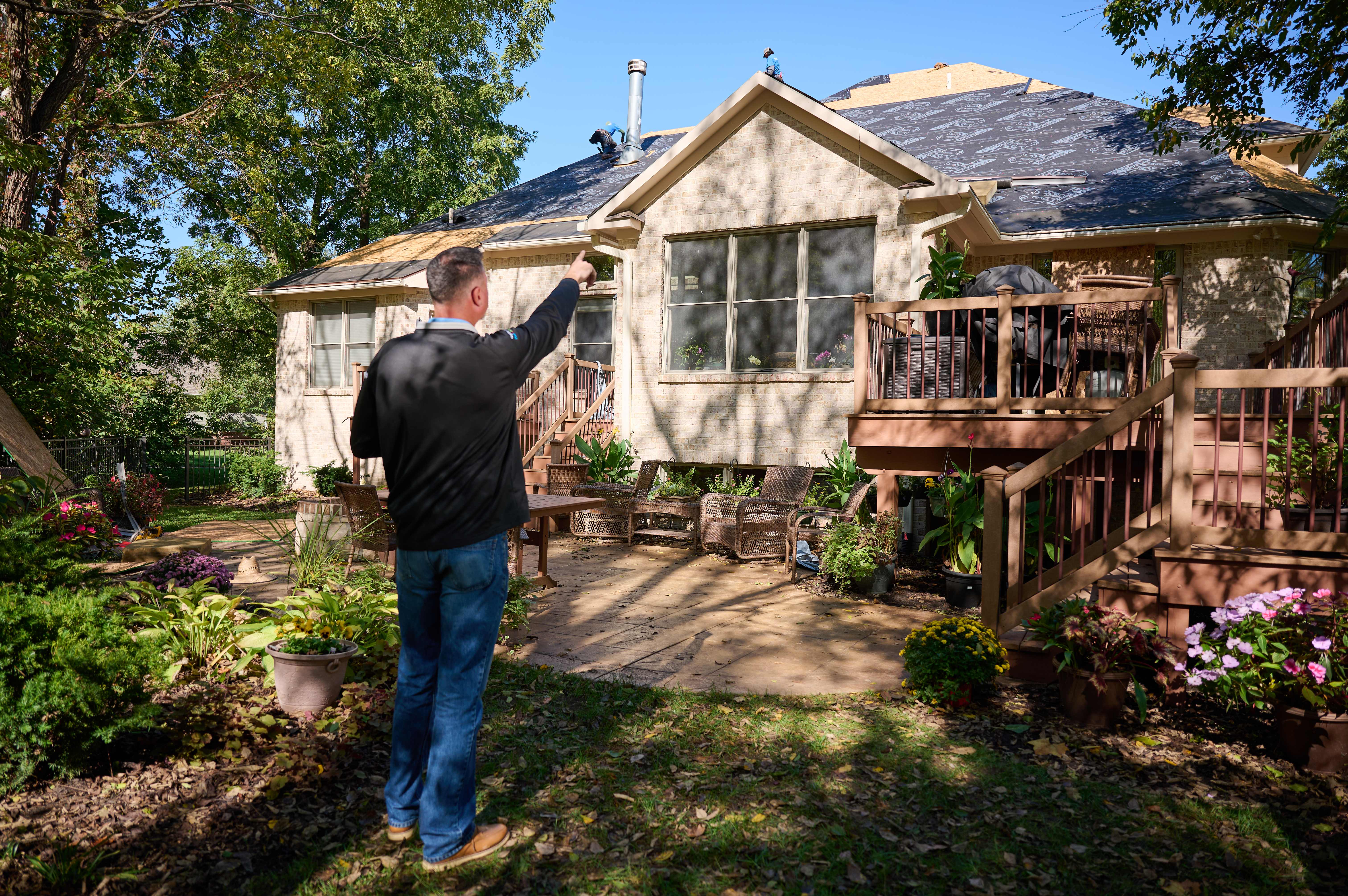 Man examining roof