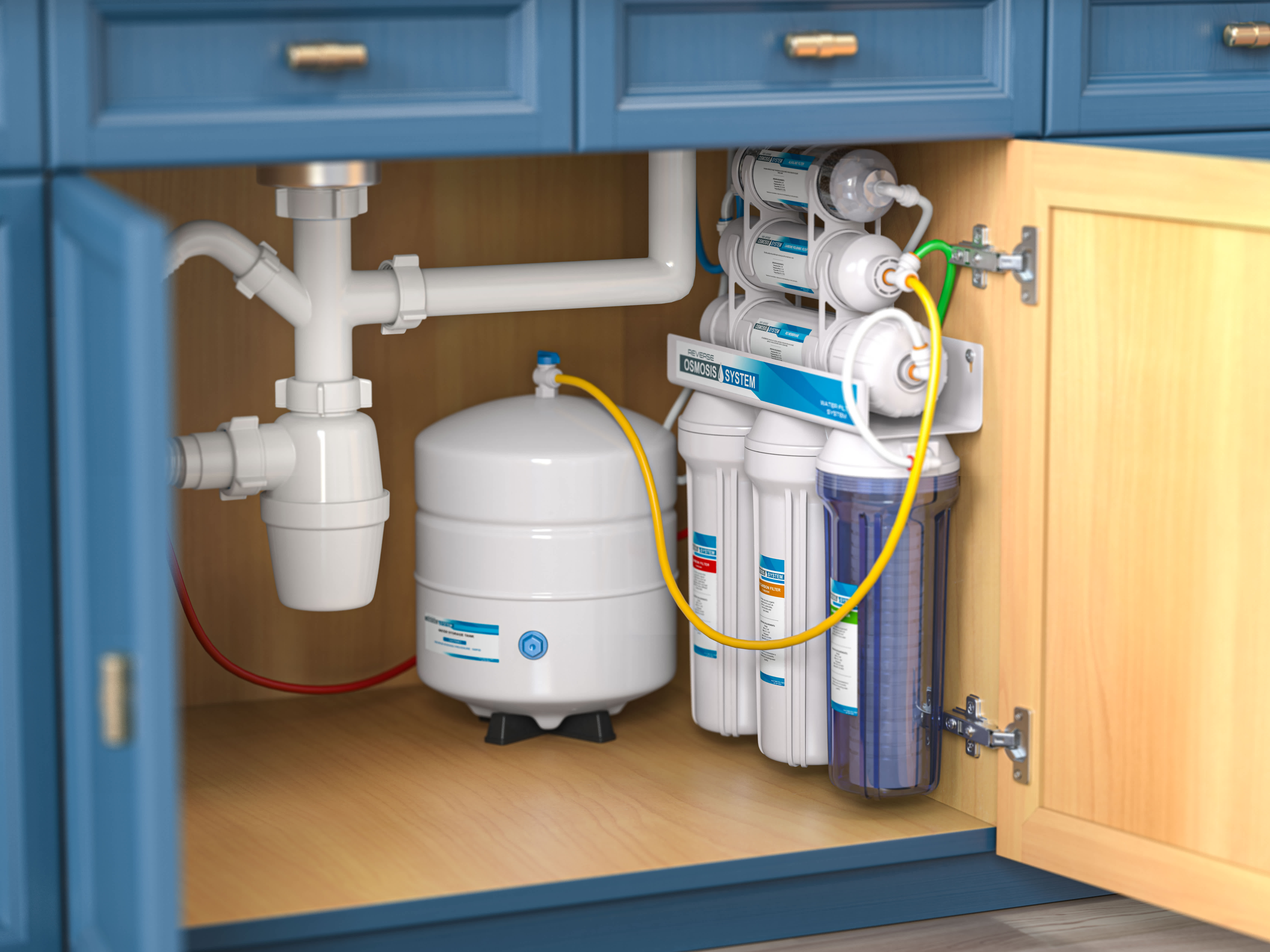 A reverse osmosis water purification system is installed under a kitchen sink, showcasing modern water treatment and filtration technology