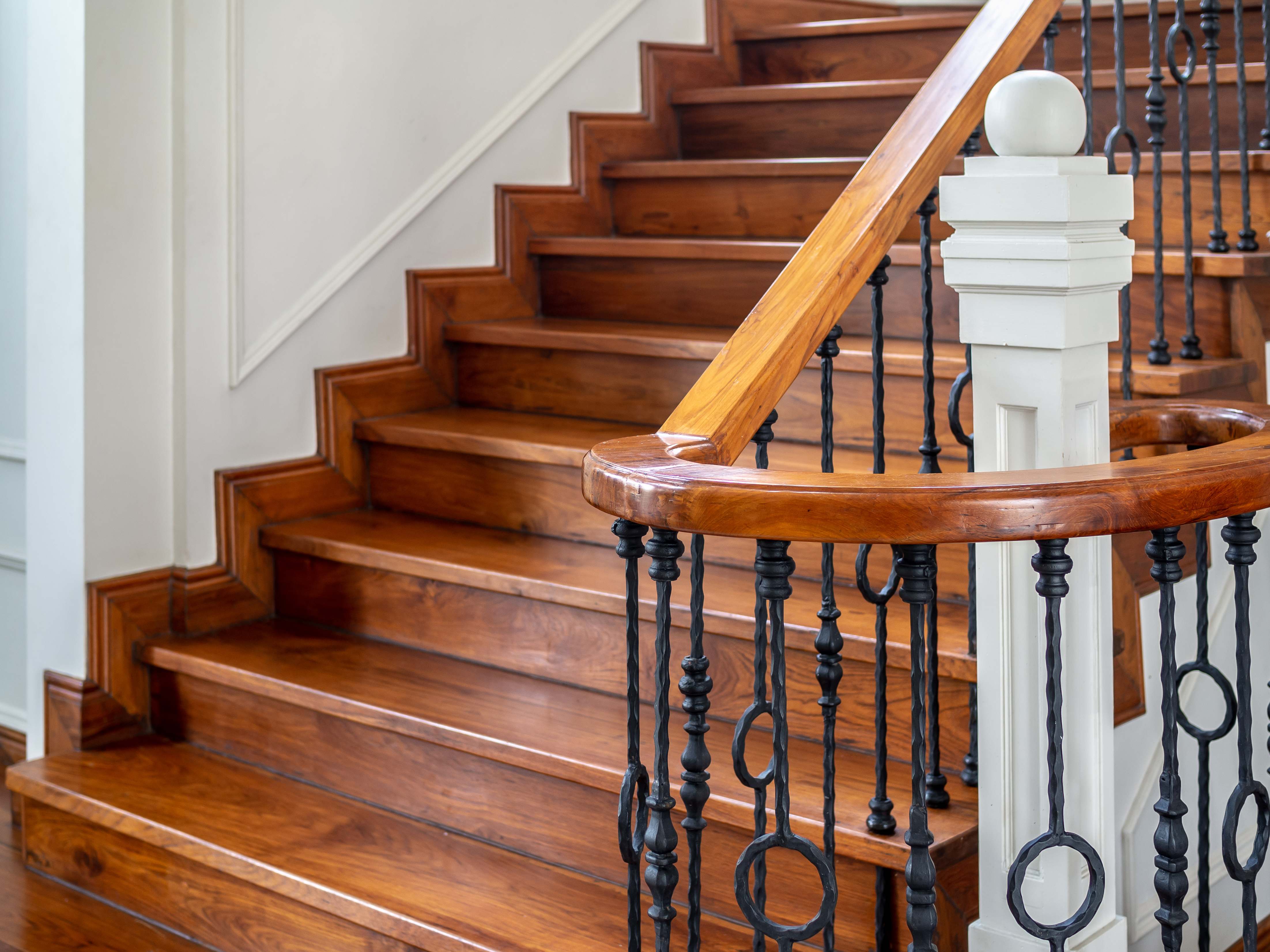 Classic wooden stairs and railings in a contemporary house, showcasing elegant design with polished wood and vintage charm