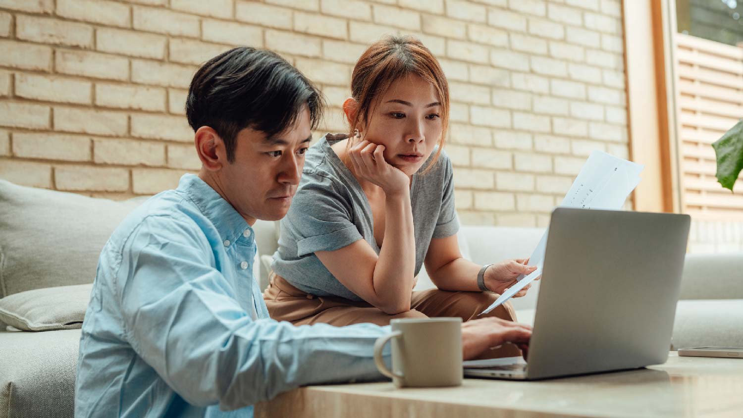 A couple submitting the application to get a building permit