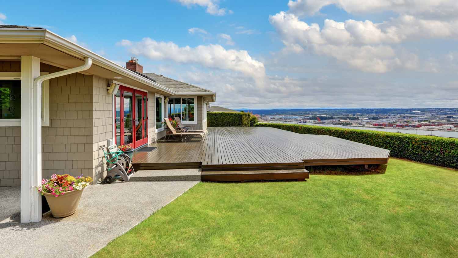 luxury house with wooden walkout deck