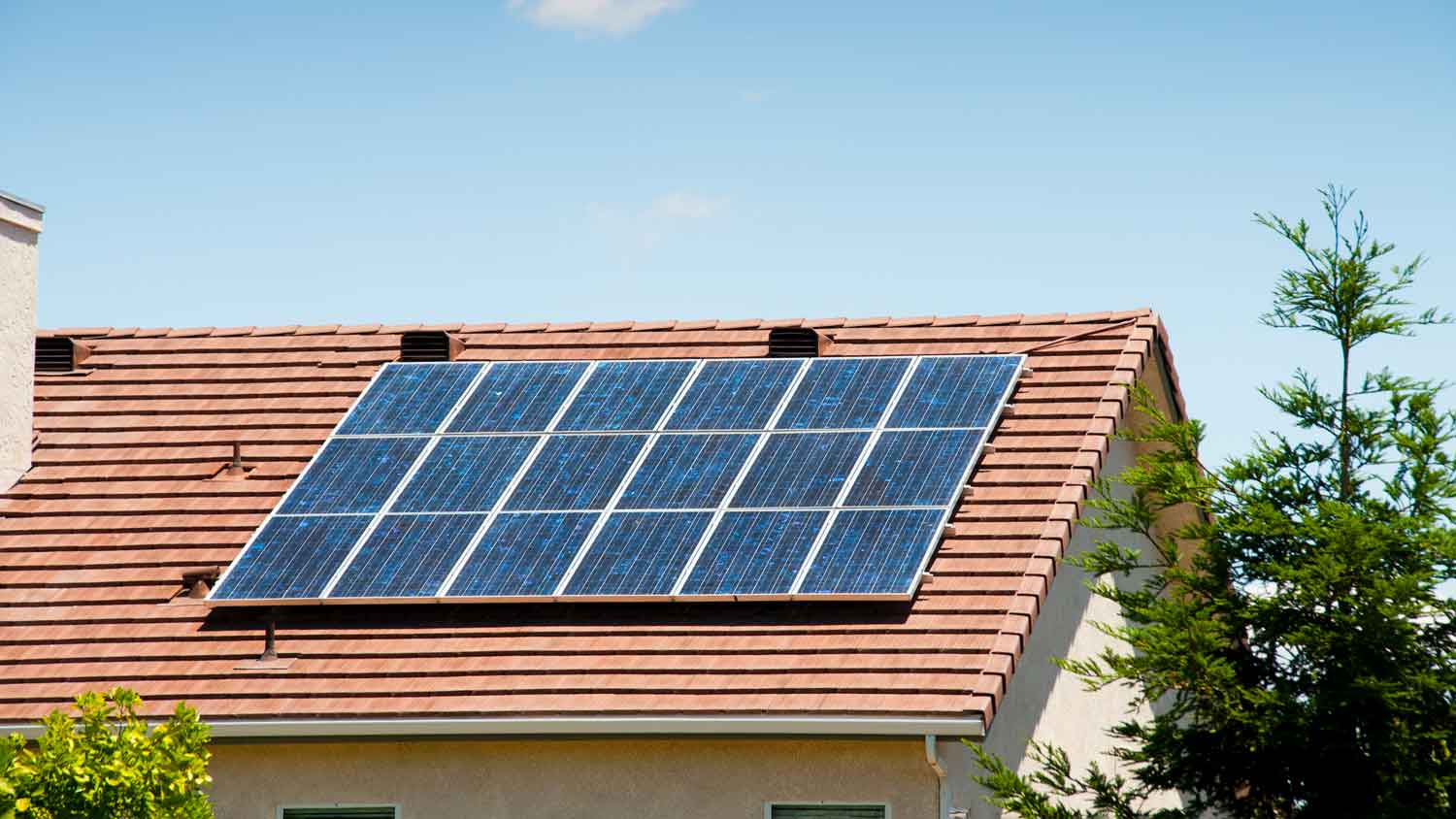 modern solar panel on red roof
