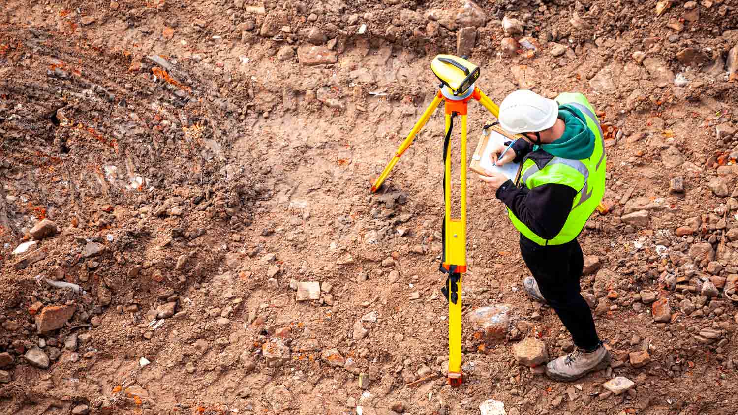 topographic surveyor on construction site